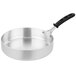 A close-up of a Vollrath Wear-Ever aluminum saute pan with a TriVent silicone handle.