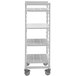 A white Cambro Camshelving Premium mobile shelving unit with 4 solid shelves on wheels.