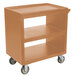 A coffee beige Cambro plastic service cart with three shelves and wheels.