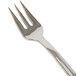 A close-up of a WNA Comet Reflections Petites stainless steel look plastic fork.