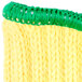 A close-up of a green and yellow crocheted hat with a green brim.