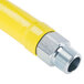 A yellow gas hose with silver metal connectors.