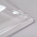 A Cambro clear plastic dome cover with a clear edge.