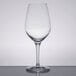 A Stolzle Celebration wine glass on a table.