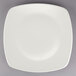 A Tuxton square china plate with a white rim on a gray background.