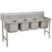 An Advance Tabco stainless steel sink with four compartments.