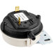 A black and white circular Accutemp air pressure switch with a white label.