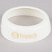 A white plastic circular Tablecraft salad dressing dispenser collar with beige lettering reading "Fat Free French"
