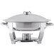 A Vollrath stainless steel large oval chafer with a lid on a stand.