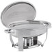 A stainless steel Vollrath Orion Lift-Off Large Oval Chafer on a table.