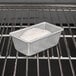 Aluminized steel bread loaf pan with a loaf of bread in it.
