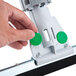 A hand using a Unger SmartFit WaterWand with a green button