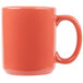 A close up of a Tuxton Cinnebar mug with a red handle.