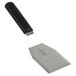 A Mercer Culinary Millennia heavy duty turner with a black handle and silver blade.