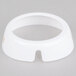 A white circular plastic dispenser collar with beige lettering and a hole in the center.