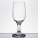 An Anchor Hocking Excellency wine glass on a white surface.