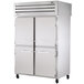 A True reach-in refrigerator with solid front half doors and glass back full doors.