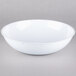 A Fineline white plastic round bowl.