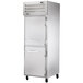 A silver True Spec Series reach-in freezer with two half doors.