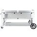A Crown Verity portable outdoor griddle with two wheels.