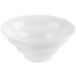 A CAC bone white porcelain bowl with a curved rim.