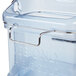A Rubbermaid clear plastic ice tote with a blue handle.