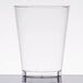 A Fineline clear hard plastic tumbler on a white table.