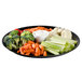 A WNA Comet black catering tray with vegetables and dip on it.