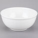 A white Cal-Mil melamine bowl on a gray surface.