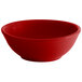 A red Tuxton china nappie bowl with a white background.
