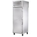 A large silver True pass-through refrigerator with a white door and handle.