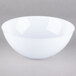 A white Fineline plastic bowl with a curved edge.