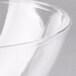 A close-up of a clear Fineline plastic bowl.