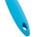 A stainless steel circle cutter with a blue silicone handle.