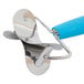 A stainless steel circle dough cutter with a blue silicone handle.