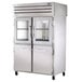 A True stainless steel pass-through refrigerator with half glass doors on the front and full glass doors on the back.