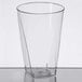 A clear plastic Fineline square bottom tumbler on a table.