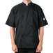 A man wearing a Mercer Culinary black chef coat.