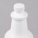 A white plastic bottle of Solwave Fusion Oven Cleaner with a white cap.