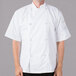 A man wearing a white Mercer Culinary chef jacket with cloth knot buttons.