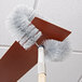 A Carlisle wall and ceiling fan duster brush on a ceiling fan.