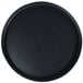 A black round tray with a matte wave design.