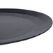 A close-up of a 10 Strawberry Street black charger plate with a circular rim.