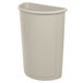 A beige Rubbermaid half round trash can with a lid.