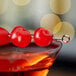 A cocktail with a Regal Maraschino cherry in it.