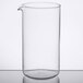 A clear Libbey glass beaker on a table.