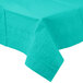A teal lagoon table cover with a pattern on it on a table.