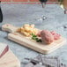 Choice 13" x 5 1/2" x 3/4" Small Wooden Bread Cutting Board with Knife Slot and Handle Main Thumbnail 1