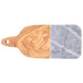 An American Metalcraft olive wood and gray marble serving board with wooden handle.