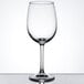 An Arcoroc Excalibur wine glass on a reflective surface.